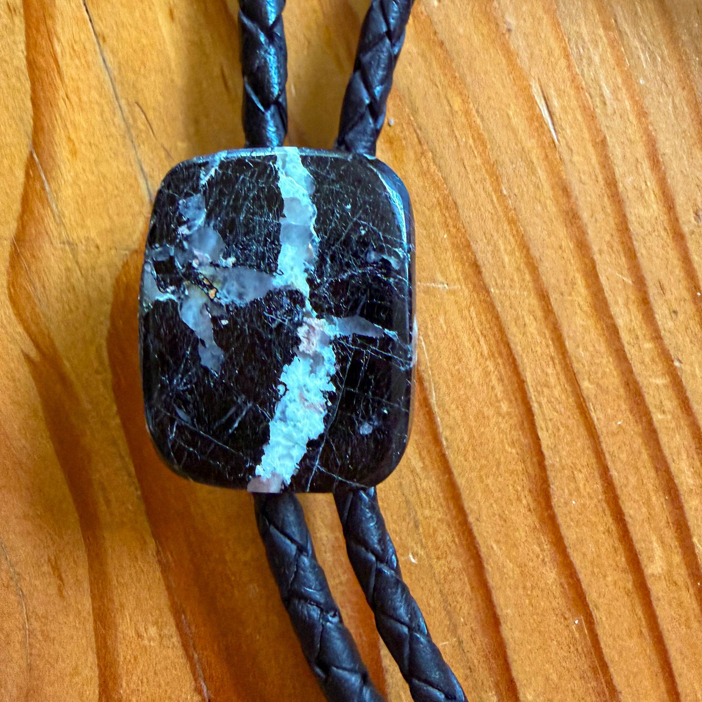 Buffalo Turquoise Bolo Tie - Black Braided Leather Cord, Antique Silver SUN Tips