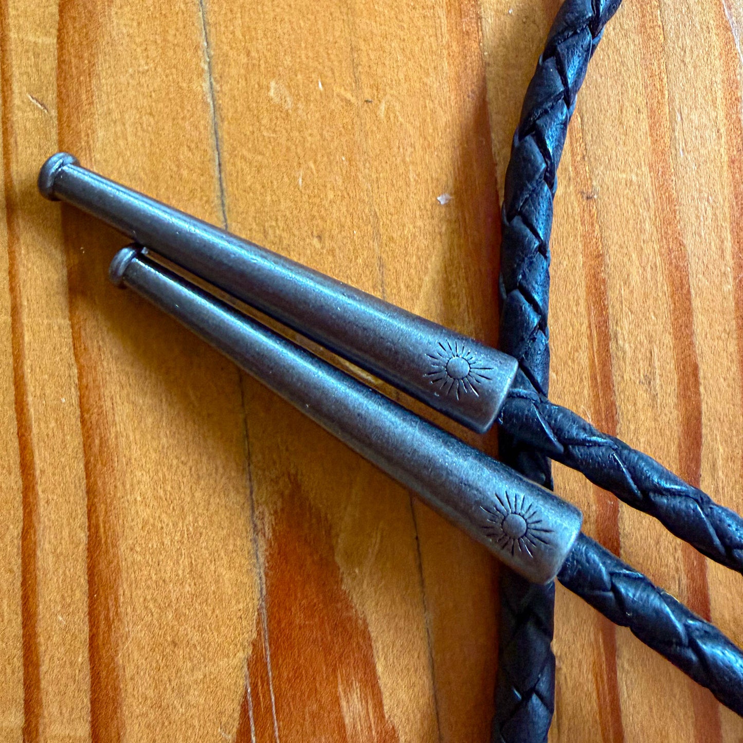 Buffalo Turquoise Bolo Tie - Black Braided Leather Cord, Antique Silver SUN Tips
