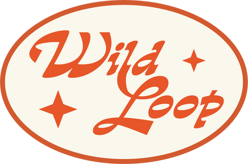 A circular logo with the text Wild Loop in stylized orange letters. Surrounding the text are three orange star shapes. The background is white with an orange border.